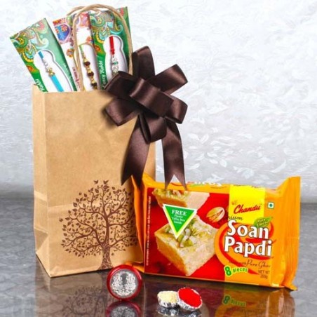 Three Designer Rakhis with Laxmi Ganesha Coin and  Milk Peda